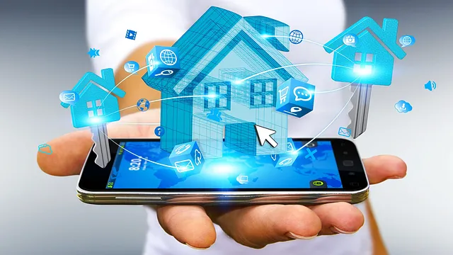 Businessman connecting digital blue house and keys